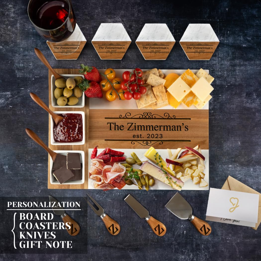 Personalized charcuterie board with food items, cutlery, and a card on a dark background.